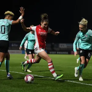 Intense Battle: Laura Wienroither of Arsenal vs Brighton's Defense at Meadow Park, FA WSL
