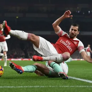 Intense Battle: Mkhitaryan vs. Smith in Arsenal's Premier League Clash against Bournemouth