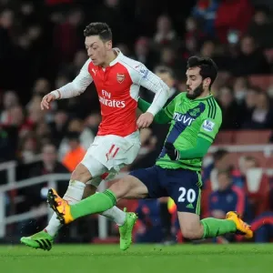 Intense Clash: Ozil vs Juanmi at Emirates Stadium - Arsenal vs Southampton, Premier League 2015-16 Intense Clash: Ozil vs Juanmi at Emirates Stadium - Arsenal vs Southampton, Premier League 2015-16