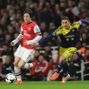 Intense Face-Off: Rosicky vs. Rangel in Arsenal's Premier League Battle