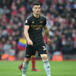 Intense Midfield Battle: Granit Xhaka Fights It Out Against Liverpool in the Premier League 2022-23