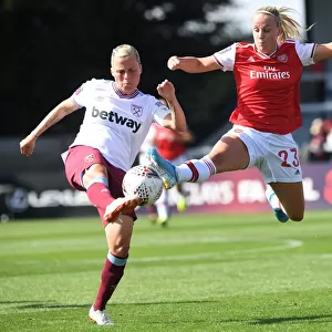 Intense Rivalry: Beth Mead vs. Gilly Flaherty - Arsenal Women vs. West Ham United Football Match