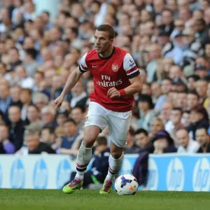The Intense Rivalry: Lukas Podolski Faces Off in the Battle of North London - Tottenham Hotspur vs. Arsenal, Premier League 2013-14 The Intense Rivalry: Lukas Podolski Faces Off in the Battle of North London - Tottenham Hotspur vs. Arsenal, Premier League 2013-14