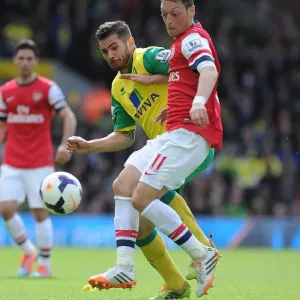 Intense Rivalry: Mesut Ozil vs. Robert Snodgrass Clash at Carrow Road, 2014