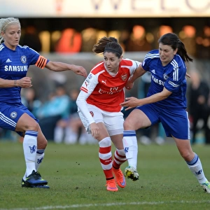 Intense Rivalry: Vicky Losada Stands Ground Against Katie Chapman and Niamh Fahey of Chelsea Ladies in Arsenal vs. Chelsea WSL Clash
