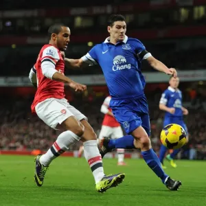 Intense Rivalry: Walcott vs. Barry in Arsenal v Everton Premier League Clash Intense Rivalry: Walcott vs. Barry in Arsenal v Everton Premier League Clash