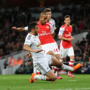 Intense Rivalry: Walcott vs. Taylor at the Emirates - Arsenal vs. Swansea City, Premier League 2014/15 Intense Rivalry: Walcott vs. Taylor at the Emirates - Arsenal vs. Swansea City, Premier League 2014/15