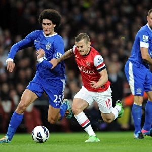 Intense Rivalry: Wilshere vs. Fallaini Clash in Arsenal vs. Everton Premier League Match