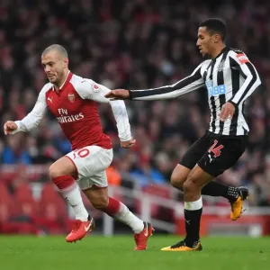 Intense Rivalry: Wilshere vs. Hayden Clash in Arsenal vs. Newcastle Football Match