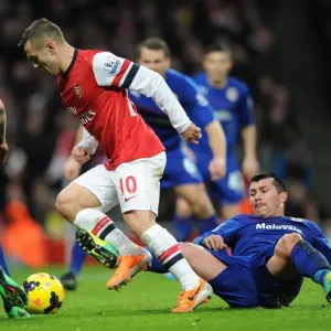 Intense Rivalry: Wilshere vs. Medel - Arsenal's Battle with Cardiff City Intense Rivalry: Wilshere vs. Medel - Arsenal's Battle with Cardiff City