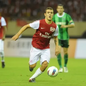 Jack Wilshere in Action: Arsenal's Star Midfielder Shines in Pre-Season Friendly against Hangzhou Greentown, China (2011) Jack Wilshere in Action: Arsenal's Star Midfielder Shines in Pre-Season Friendly against Hangzhou Greentown, China (2011)