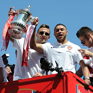 Jack Wilshere and Alex Oxlade-Chamberlain on the Arsenal Trophy Parade. Islington, 18 / 5 / 14