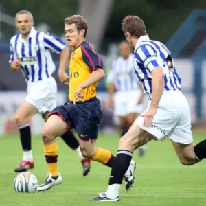 Jack Wilshere (Arsenal) Chris Lucketti (Huddersfield) Jack Wilshere (Arsenal) Chris Lucketti (Huddersfield)