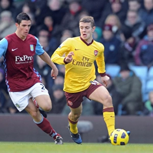 Jack Wilshere (Arsenal) Ciaran Clark (Villa). Aston Villa 2: 4 Arsenal. Barclays Premier League