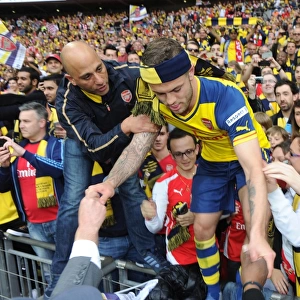 Jack Wilshere (Arsenal) climbs out of the crowd. Arsenal 4: 0 Aston Villa. FA Cup Final