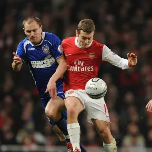 Jack Wilshere (Arsenal) Colin Healy (Ipswich). Arsenal 3: 0 Ipswich Town (3: 1 agg)