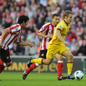 Jack WIlshere (Arsenal) Cristian Riveros and Steed Malbranque (Sunderland) Jack WIlshere (Arsenal) Cristian Riveros and Steed Malbranque (Sunderland)