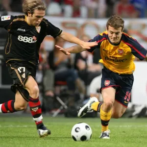 Jack Wilshere (Arsenal) Diego Trinidad (Seville) Jack Wilshere (Arsenal) Diego Trinidad (Seville)