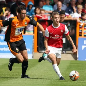 Jack Wilshere (Arsenal) Glenn Poole (Barnet). Barnet 0: 4 Arsenal. Pre Season Friendly Jack Wilshere (Arsenal) Glenn Poole (Barnet). Barnet 0: 4 Arsenal. Pre Season Friendly