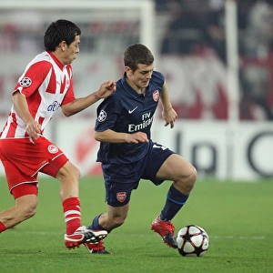 Jack Wilshere (Arsenal) Luciano Galletti (Olympiacos). Olympiacos 1: 0 Arsenal