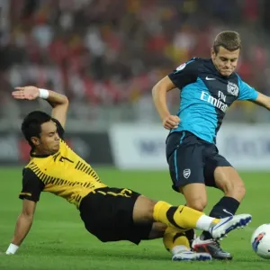 Jack Wilshere (Arsenal) Mohd Zafuan (Malaysia). Malaysia XI 0: 4 Arsenal Jack Wilshere (Arsenal) Mohd Zafuan (Malaysia). Malaysia XI 0: 4 Arsenal