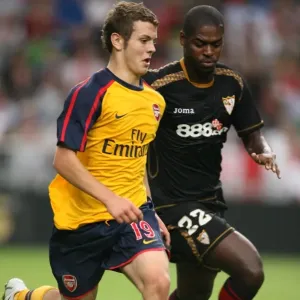 Jack Wilshere (Arsenal) Ndri Romaric (Seville) Jack Wilshere (Arsenal) Ndri Romaric (Seville)