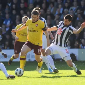 Jack Wilshere (Arsenal) Paul Scharner and Youssouf Mulumbu (WBA). West Bromwich Albion 2