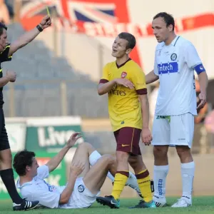 Jack Wilshere (Arsenal) is shown the yellow card by referee Alexander Harkamp Jack Wilshere (Arsenal) is shown the yellow card by referee Alexander Harkamp