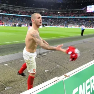 Jack Wilshere (Arsenal) throws his shirt to a fan after the match Jack Wilshere (Arsenal) throws his shirt to a fan after the match