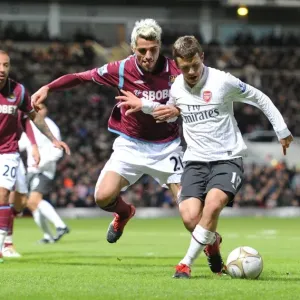 Jack Wilshere (Arsenal) Valon Behrami (West Ham). West Ham United 1: 2 Arsenal Jack Wilshere (Arsenal) Valon Behrami (West Ham). West Ham United 1: 2 Arsenal
