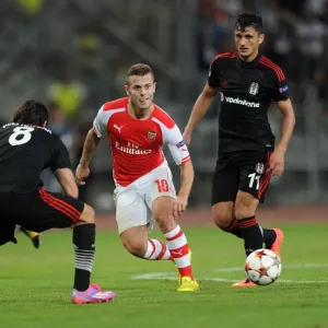 Jack Wilshere Clashes with Mustafa Pektemek and Veli Kaviak in Arsenal's UEFA Champions League Battle against Besiktas Jack Wilshere Clashes with Mustafa Pektemek and Veli Kaviak in Arsenal's UEFA Champions League Battle against Besiktas