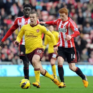 Jack Wilshere Drives Past Sunderland's Diaye and Colback