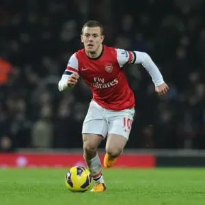 Jack Wilshere Fights for Control: Arsenal vs. West Ham in Premier League