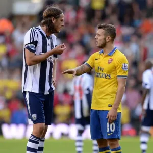 Jack Wilshere and Jonas Olsson: A Moment of Respite Amidst the West Bromwich Albion vs. Arsenal Rivalry (2013-14)