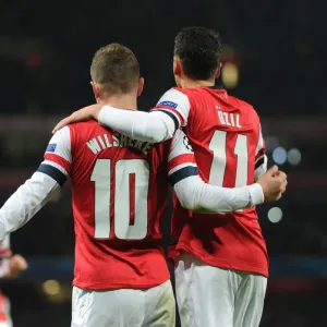 Jack Wilshere and Mesut Ozil Celebrate Goals: Arsenal vs Olympique de Marseille, UEFA Champions League, 2013 Jack Wilshere and Mesut Ozil Celebrate Goals: Arsenal vs Olympique de Marseille, UEFA Champions League, 2013
