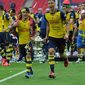 Jack Wilshere and Olivier Giroud (Arsenal) with the FA Cup Trophy after the match