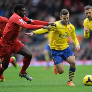 Jack Wilshere Outmaneuvers Kolo Toure: Intense Rivalry in the Premier League Clash between Arsenal and Liverpool Jack Wilshere Outmaneuvers Kolo Toure: Intense Rivalry in the Premier League Clash between Arsenal and Liverpool