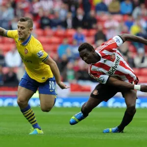 Jack Wilshere Outmaneuvers Modibo Diakite: Sunderland vs. Arsenal, Premier League 2013-14 Jack Wilshere Outmaneuvers Modibo Diakite: Sunderland vs. Arsenal, Premier League 2013-14