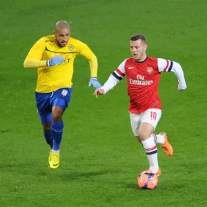 Jack Wilshere Outpaces Leon Clarke in FA Cup Fourth Round Clash between Arsenal and Coventry City Jack Wilshere Outpaces Leon Clarke in FA Cup Fourth Round Clash between Arsenal and Coventry City