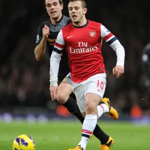 Jack Wilshere Outpaces Rival Jordan Henderson: Intense Arsenal vs. Liverpool Rivalry on the Premier League Field