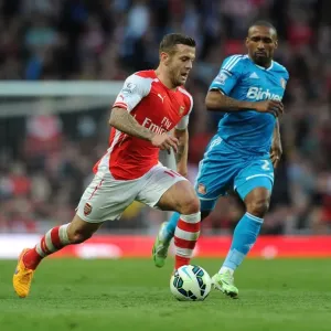 Jack Wilshere Outsmarts Jermain Defoe: Arsenal's Midfield Maestro Outmaneuvers Sunderland Rival in Thrilling 2014-15 Premier League Showdown Jack Wilshere Outsmarts Jermain Defoe: Arsenal's Midfield Maestro Outmaneuvers Sunderland Rival in Thrilling 2014-15 Premier League Showdown