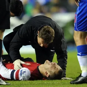 Jack Wilshere Receives Treatment from Arsenal Physio Colin Lewin during Reading vs Arsenal (2012-13)