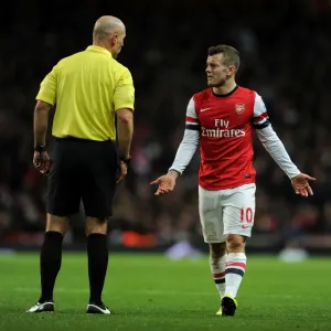Jack Wilshere and Referee Howard Webb in Action during Arsenal vs Everton, Premier League 2013-14 Jack Wilshere and Referee Howard Webb in Action during Arsenal vs Everton, Premier League 2013-14