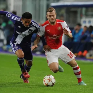 Jack Wilshere vs. Andy Najar: Midfield Battle in Arsenal's UEFA Champions League Clash with RSC Anderlecht (2014)