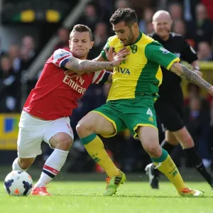 Jack Wilshere vs. Bradley Johnson: Intense Battle in Norwich City vs. Arsenal (2013-14)