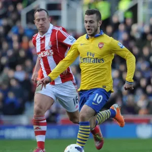 Jack Wilshere vs. Charlie Adam: Midfield Showdown in Arsenal vs. Stoke City Premier League Clash (2013-14)