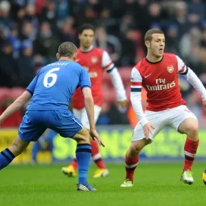 Jack Wilshere vs. David Jones: Intense Battle in Wigan Athletic vs. Arsenal (2012-13 Premier League)