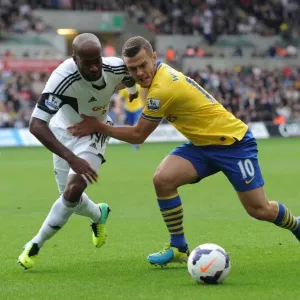 Jack Wilshere vs. Dwight Tiendalli: Intense Battle in Swansea City vs. Arsenal Premier League Clash Jack Wilshere vs. Dwight Tiendalli: Intense Battle in Swansea City vs. Arsenal Premier League Clash