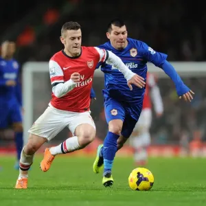 Jack Wilshere vs Gary Medel: Midfield Battle in Arsenal vs Cardiff City, Premier League Jack Wilshere vs Gary Medel: Midfield Battle in Arsenal vs Cardiff City, Premier League