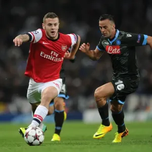 Jack Wilshere vs. Giandomenico Mesto: A Football Battle in the Arsenal vs. Napoli UEFA Champions League Clash, 2013 Jack Wilshere vs. Giandomenico Mesto: A Football Battle in the Arsenal vs. Napoli UEFA Champions League Clash, 2013